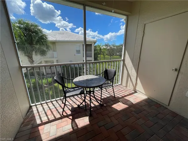 a view of a balcony with furniture