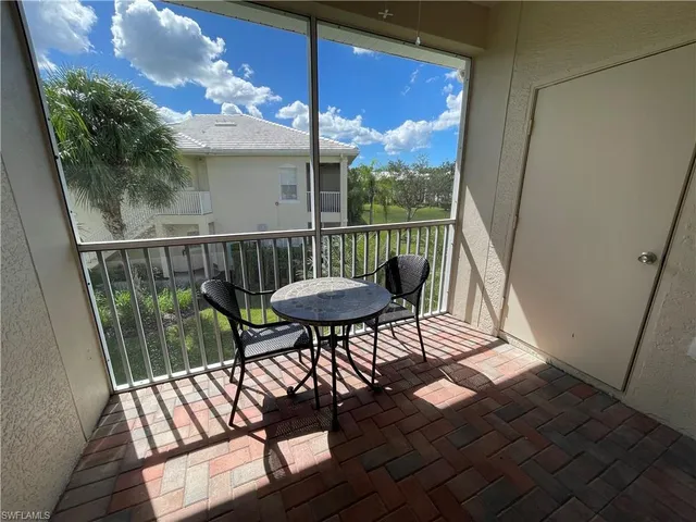 a view of a balcony with furniture