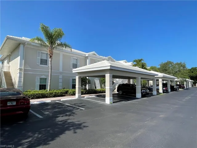 a view of a building with a yard