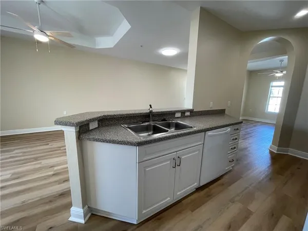 a kitchen with a sink and cabinets