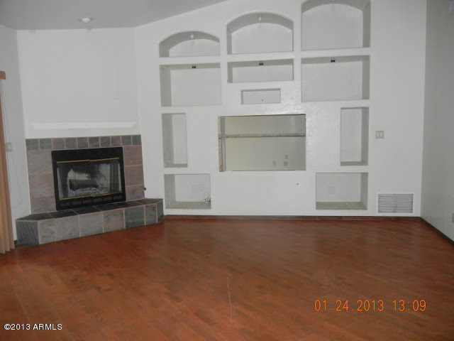 2527 East Joy Ranch Road Cave Creek, AZ 85331 - Photo 4 of 34 Family Room/Fireplace/Wood Floors