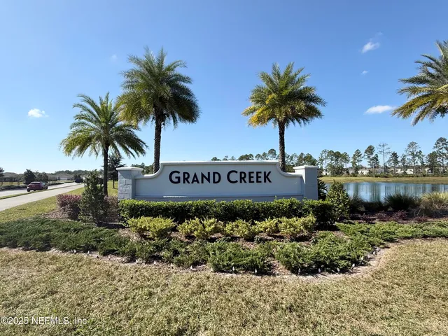 a sign that is in front of flowers