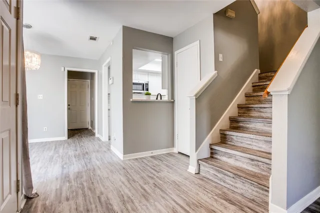 a view of entryway with wooden floor