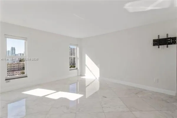a view of an empty room and window
