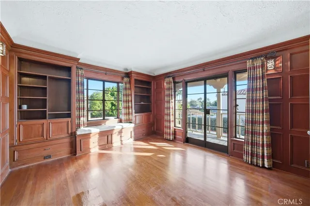 a bathroom with a sink a mirror a bathtub and next to a window