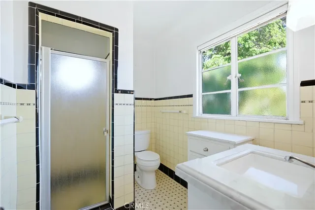 an aerial view of multiple houses with yard