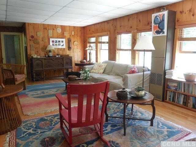 277 Birch Hill Road Copake, NY 12521 - Photo 5 of 19 a living room with furniture and a window
