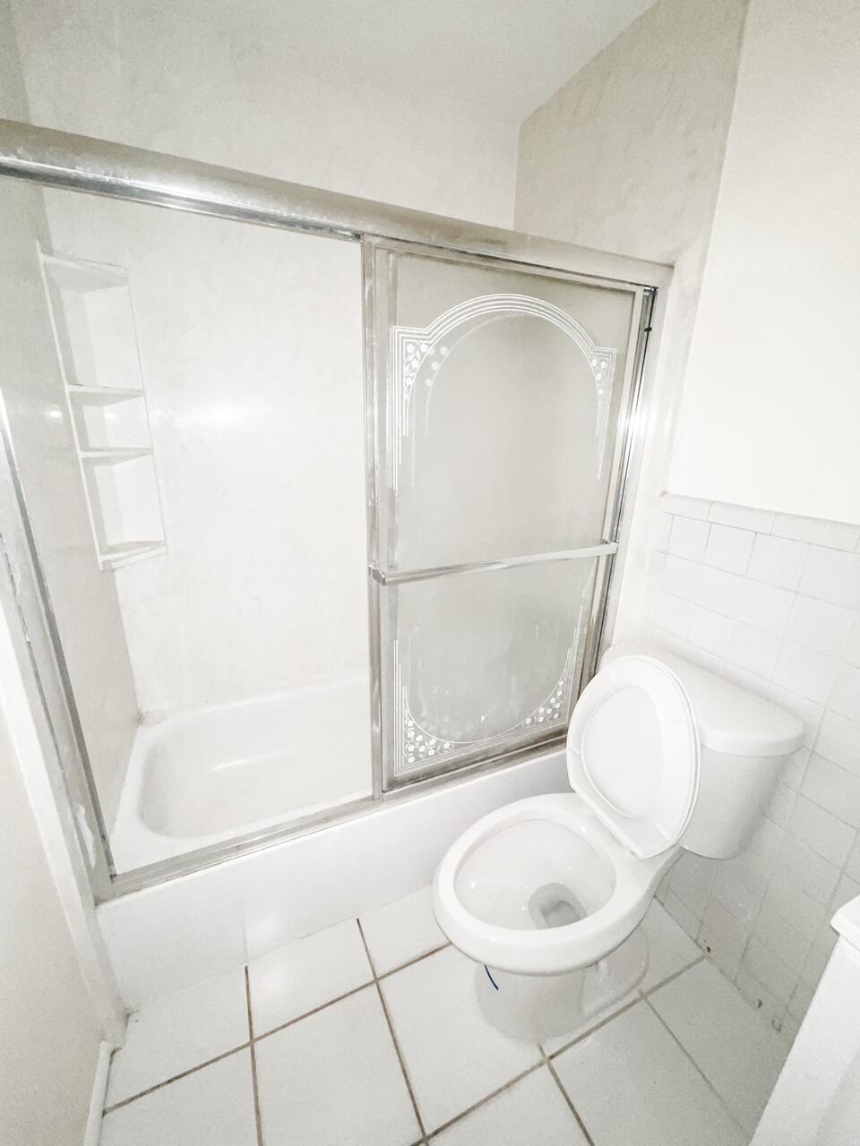 2213 2nd Street Southwest Vero Beach, FL 32962 - Photo 14 of 18 a bathroom with a toilet and a shower