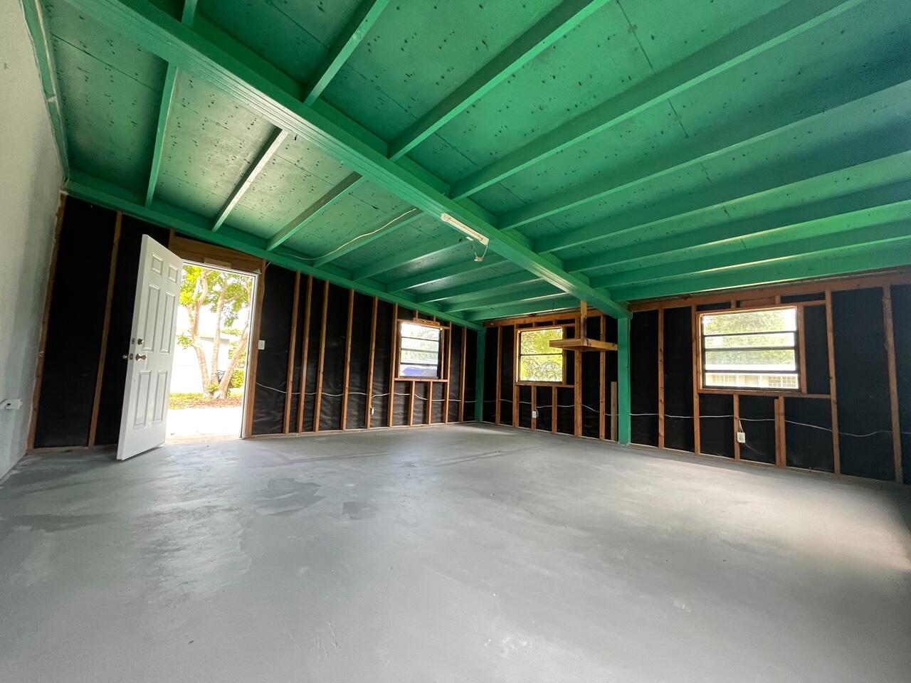 2213 2nd Street Southwest Vero Beach, FL 32962 - Photo 7 of 18 a view of an empty room with a window and a fireplace