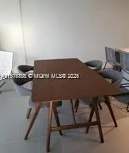 a view of a workspace with furniture