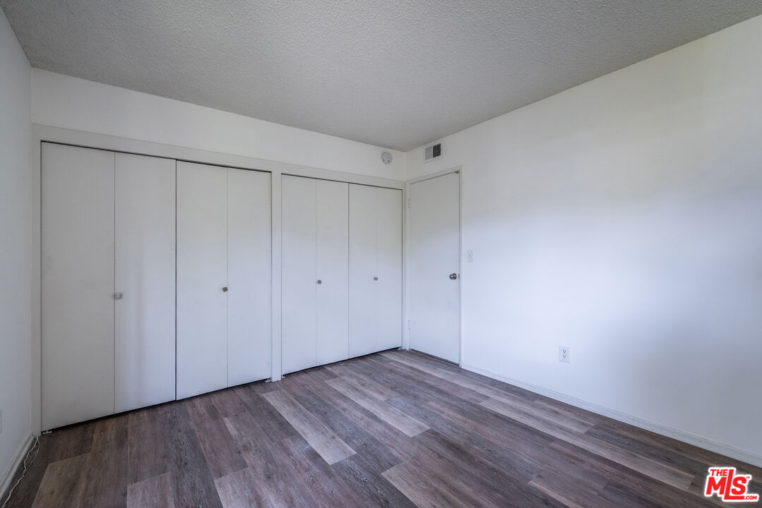 1342 Stradella Road Los Angeles, CA 90077 - Photo 12 of 24 a view of a room with wooden floor