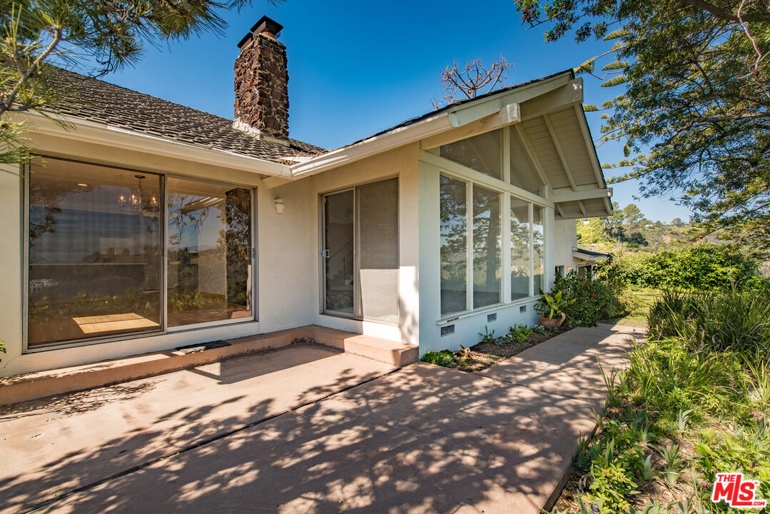 1342 Stradella Road Los Angeles, CA 90077 - Photo 16 of 24 a front view of a house with a porch