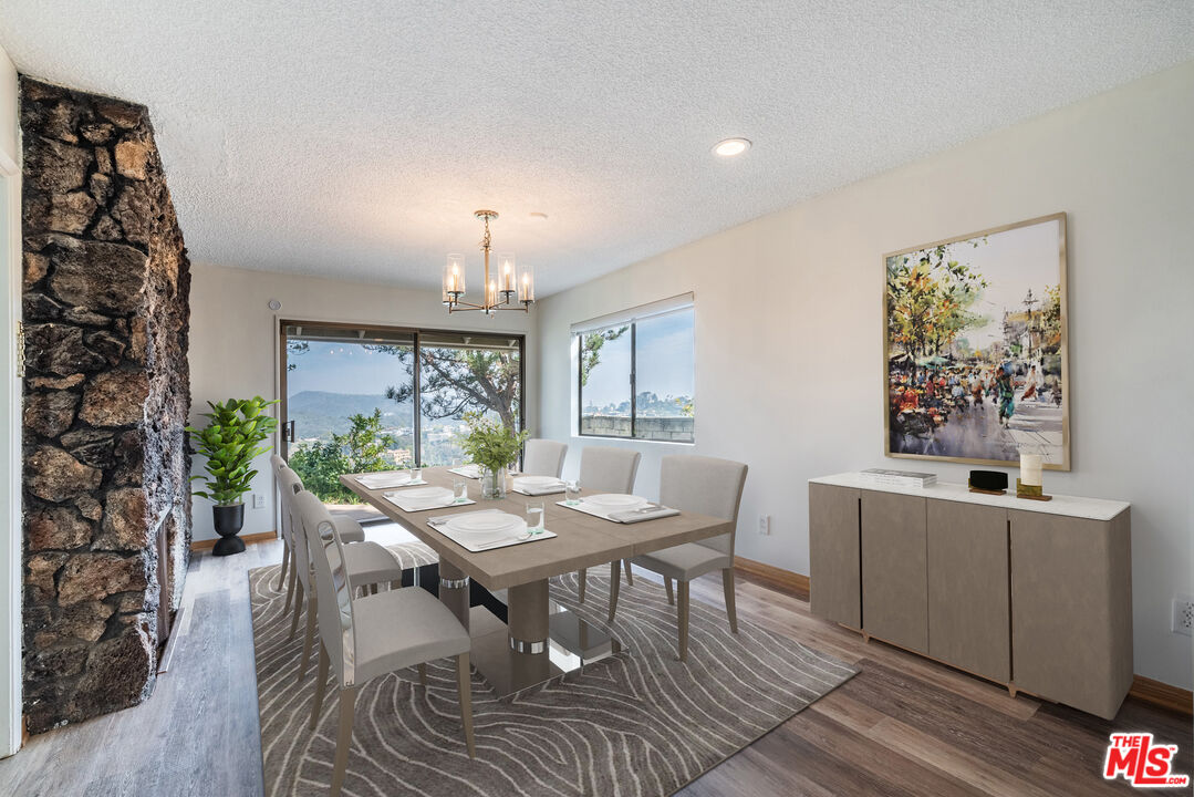 1342 Stradella Road Los Angeles, CA 90077 - Photo 6 of 24 a view of a dining room with furniture window and wooden floor