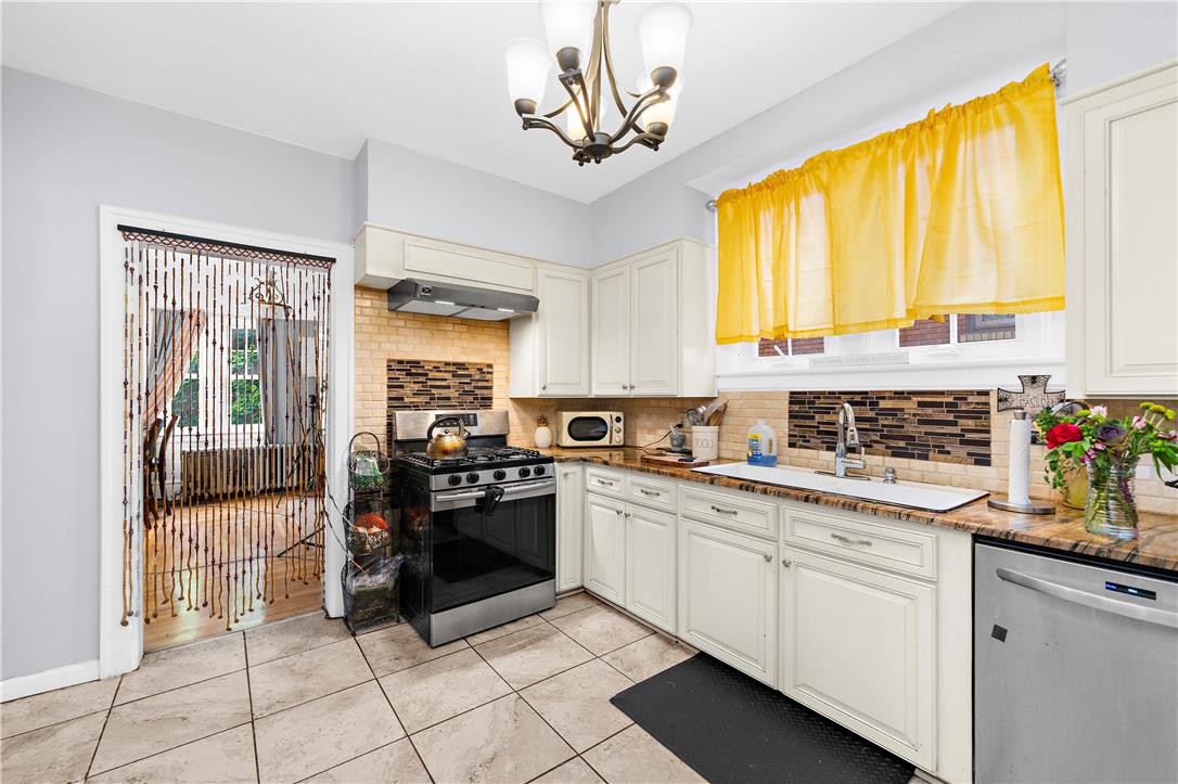2055 Ferry Street Wilson, PA 18042 - Photo 6 of 21 Bright and functional, this kitchen combines practicality with ample cabinet space.