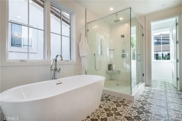 a bathroom with a bathtub and a shower