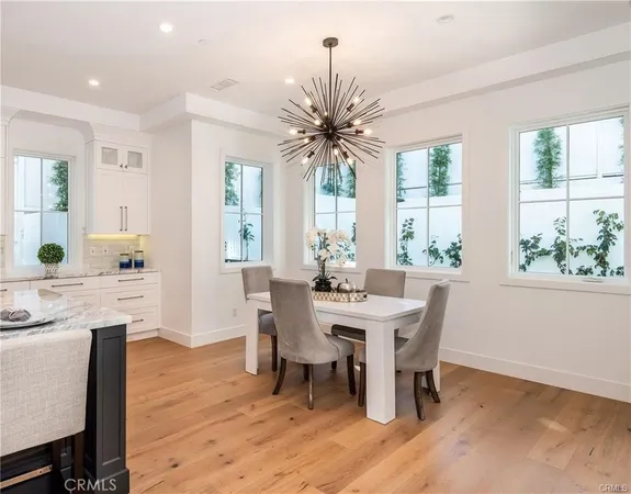 a view of a dining room with furniture and window
