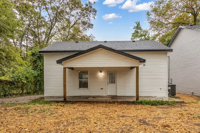 a house with trees in the background