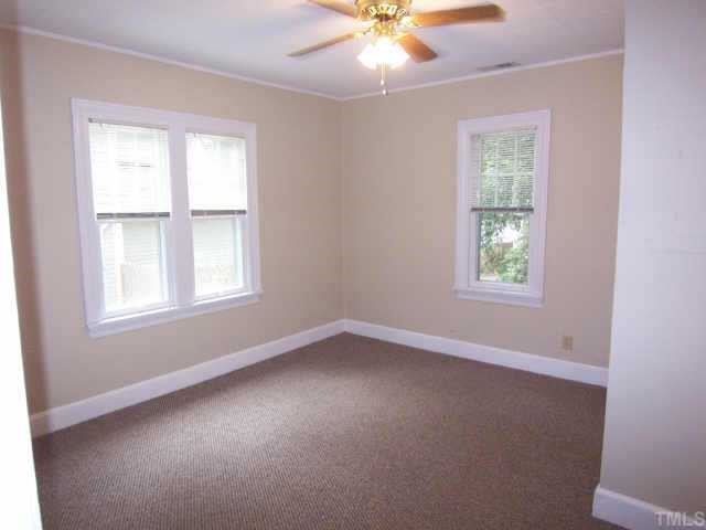 607 Adams Street Raleigh, NC 27605 - Photo 5 of 9 an empty room with a window