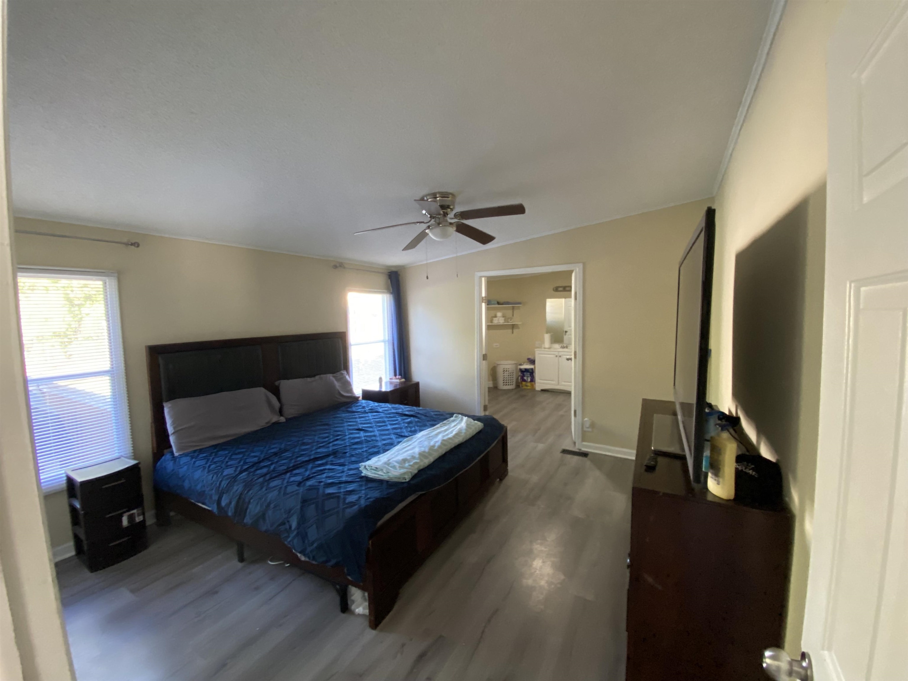 6036 Rock Quarry Road Raleigh, NC 27610 - Photo 11 of 17 a bedroom with a bed and wooden floor