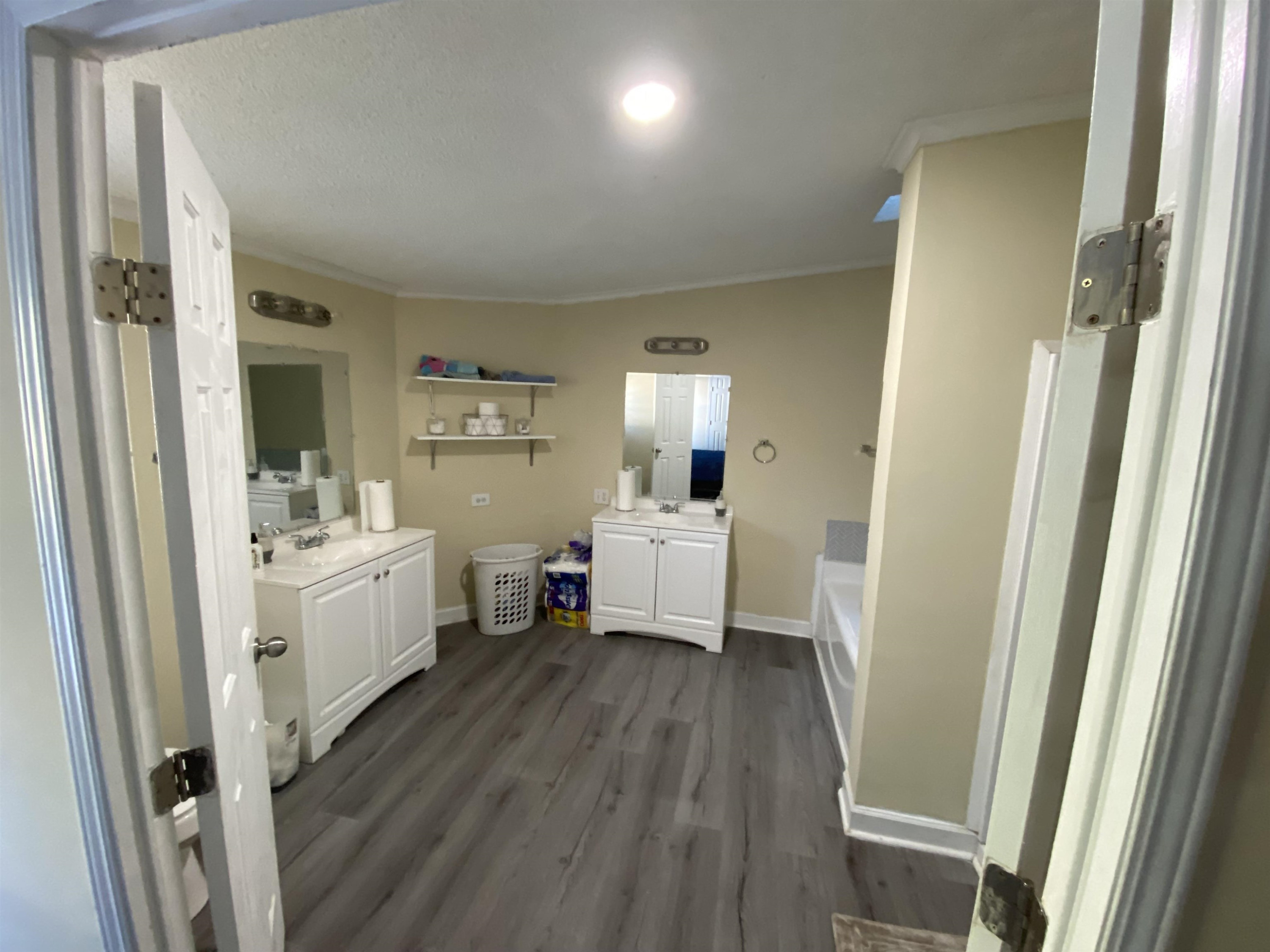 6036 Rock Quarry Road Raleigh, NC 27610 - Photo 13 of 17 a bathroom with sink a vanity and shower