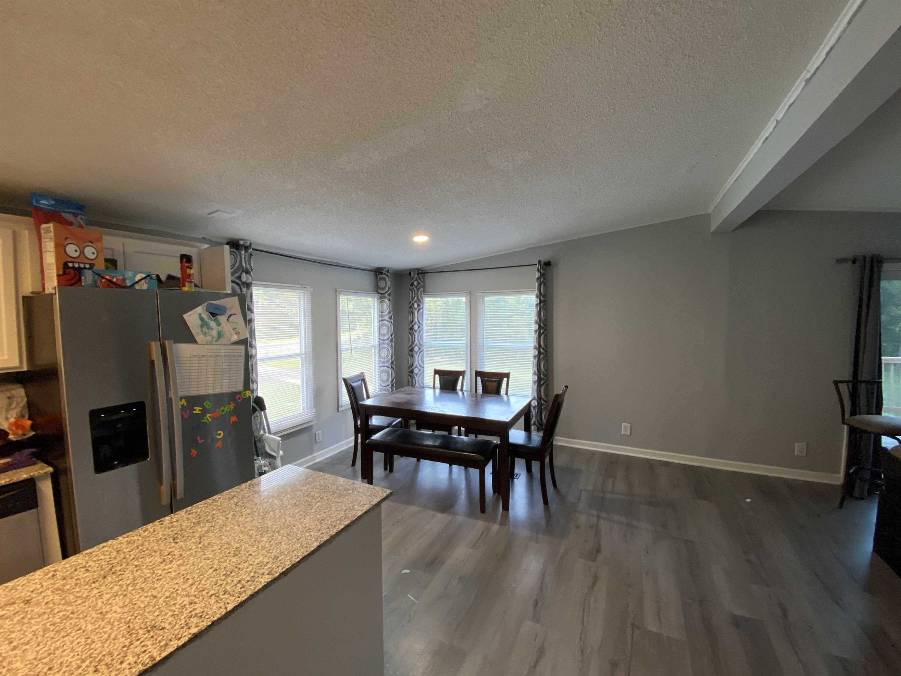 6036 Rock Quarry Road Raleigh, NC 27610 - Photo 2 of 17 a view of a dining room with furniture and window