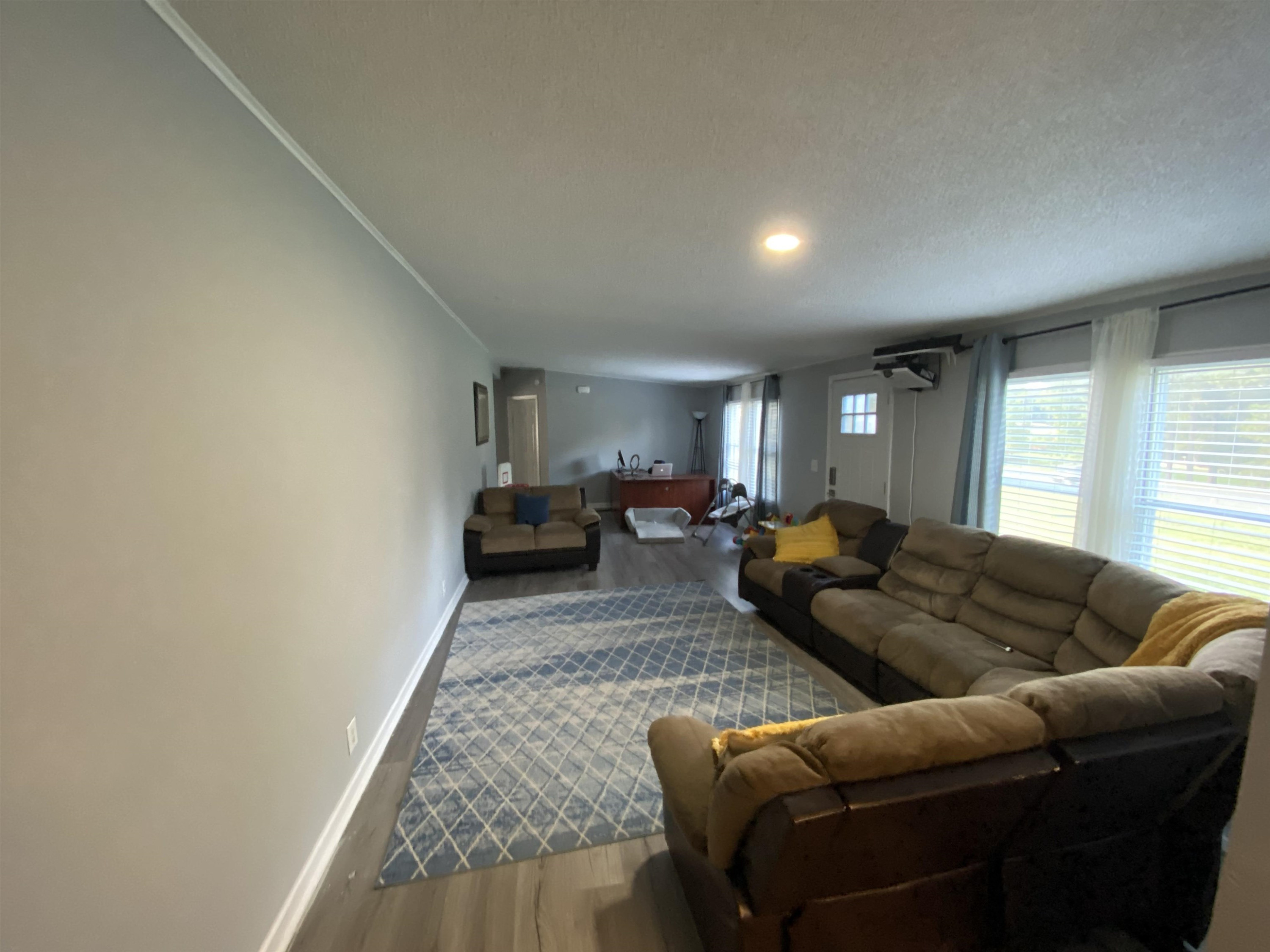 6036 Rock Quarry Road Raleigh, NC 27610 - Photo 4 of 17 a living room with furniture and a couch