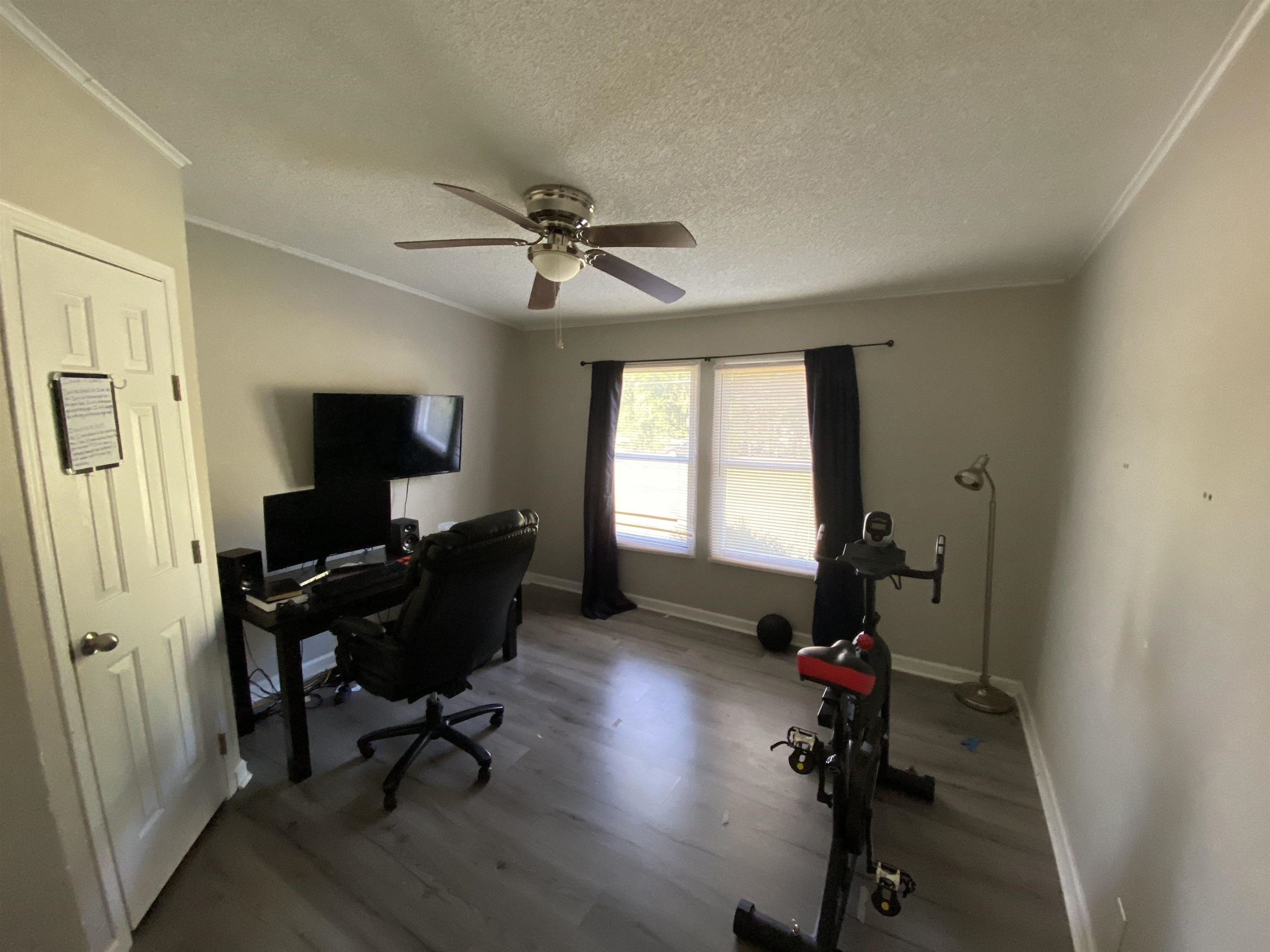 6036 Rock Quarry Road Raleigh, NC 27610 - Photo 7 of 17 a view of a workspace with furniture and a window