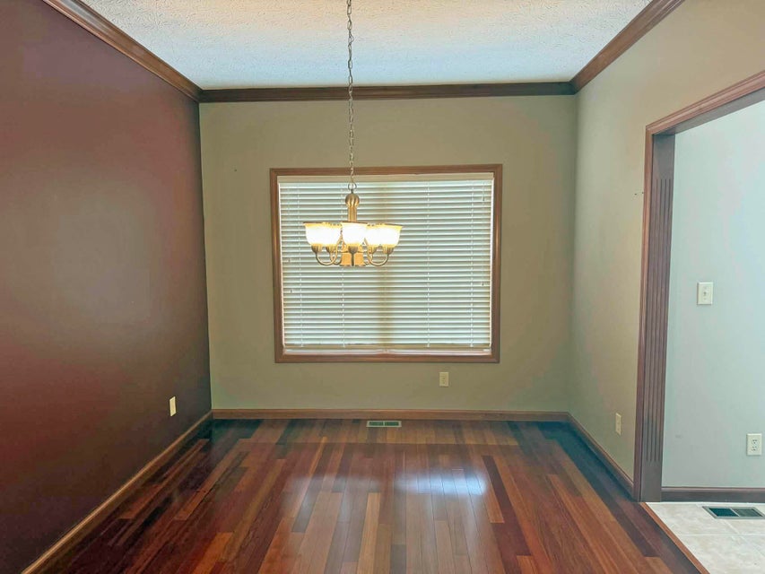 541 North Point Troy, OH 45373 - Photo 5 of 23 This versatile room features gleaming hardwood floors and elegant crown molding, ready for your personal touch.