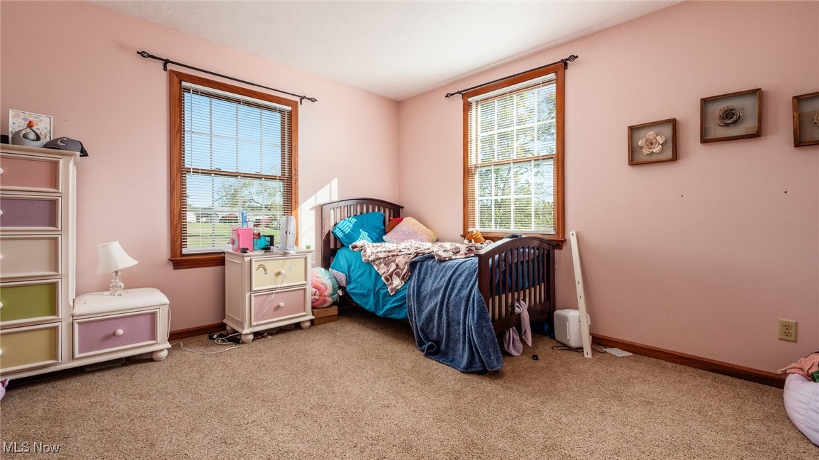 62960 James Road Cambridge, OH 43725 - Photo 27 of 40 Bedroom featuring light colored carpet and baseboards