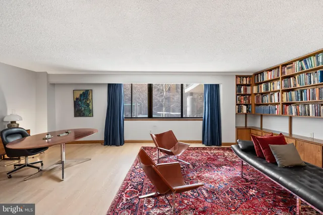 a bed room with a bed and a window