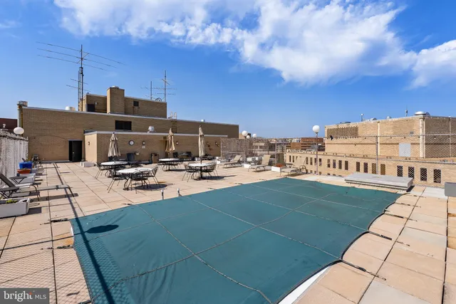 a view of a swimming pool with a patio