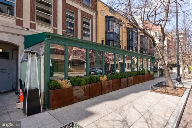 a buildings with table and chairs