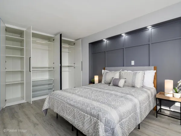 a bedroom with a bed and a closet