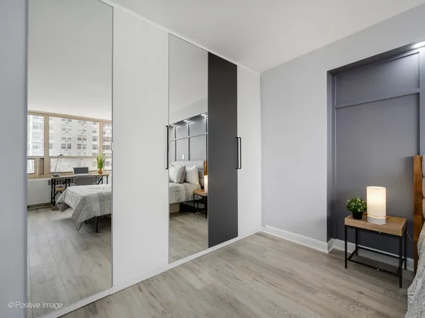 a bedroom with furniture and a window