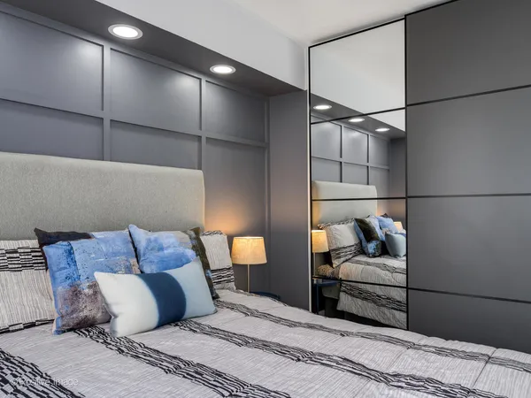a bedroom with a bed and a couch