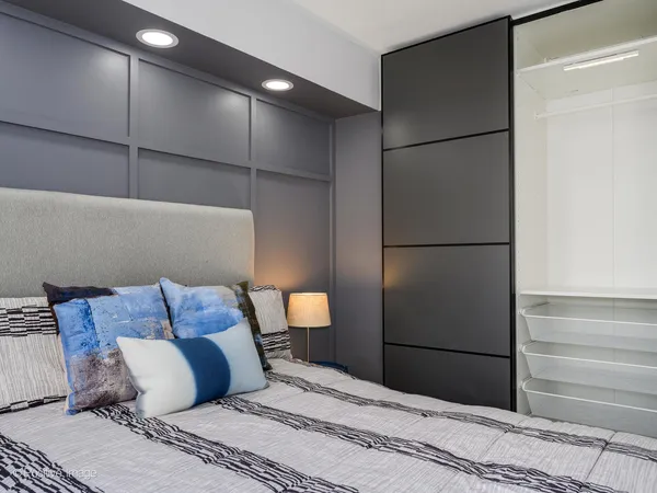 a bedroom with a bed and a closet