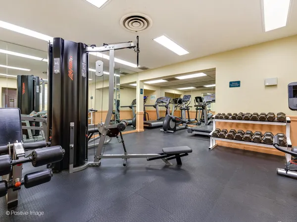 a living room with furniture gym equipment
