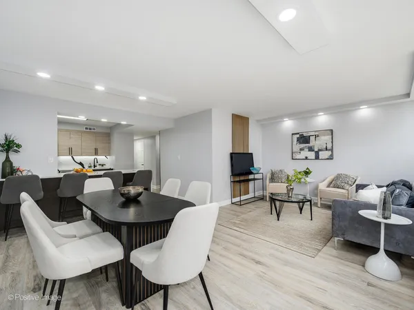 a view of a dining room with furniture and wooden floor