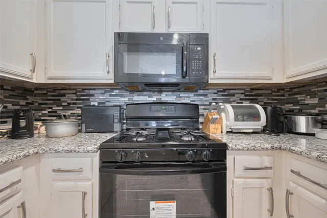 a bedroom with a bed and a chair