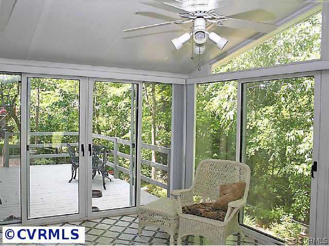 7158 Barkbridge Road Chesterfield, VA 23832 - Photo 4 of 10 a living room with furniture and a floor to ceiling window