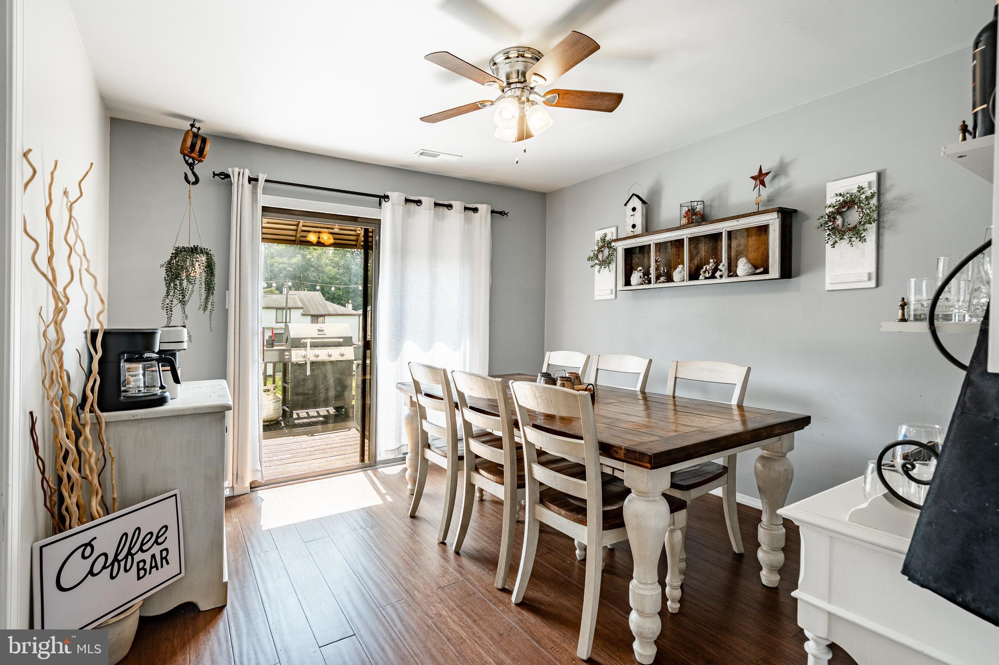 32-4 Wister Way Reading, PA 19606 - Photo 14 of 47 a view of a dining room with furniture a chandelier and wooden floor