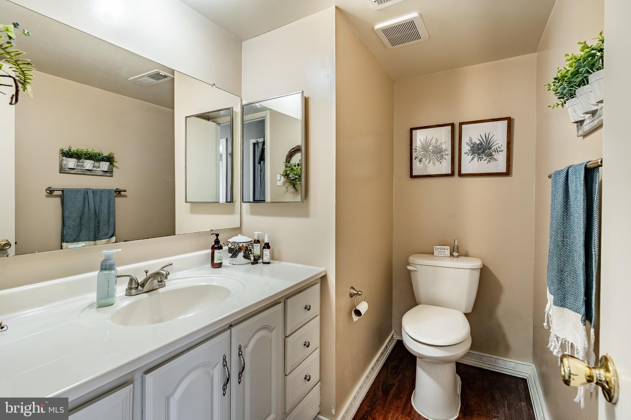 32-4 Wister Way Reading, PA 19606 - Photo 16 of 47 a bathroom with a toilet sink and mirror