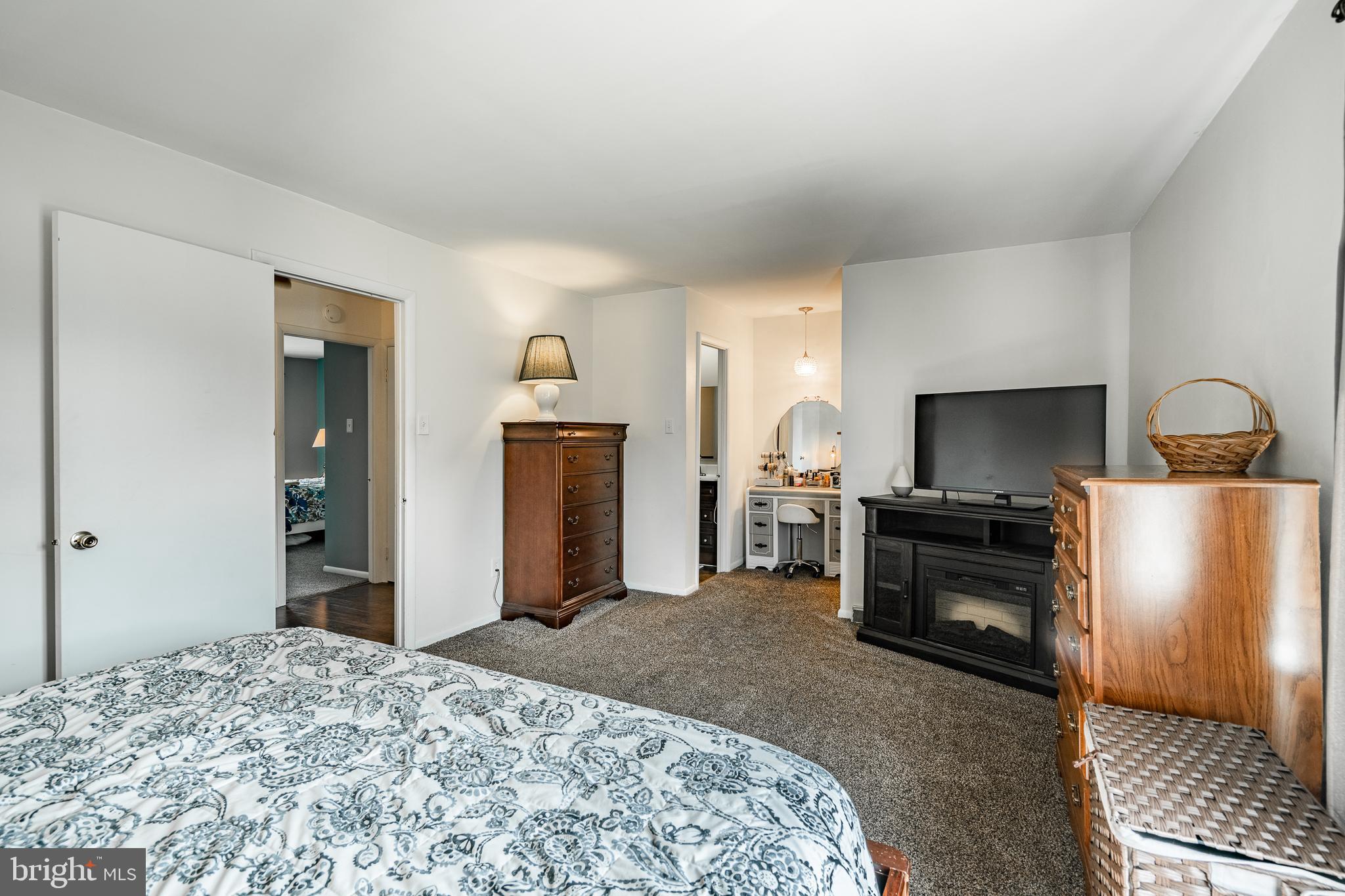 32-4 Wister Way Reading, PA 19606 - Photo 21 of 47 a bedroom with a bed and a television in it