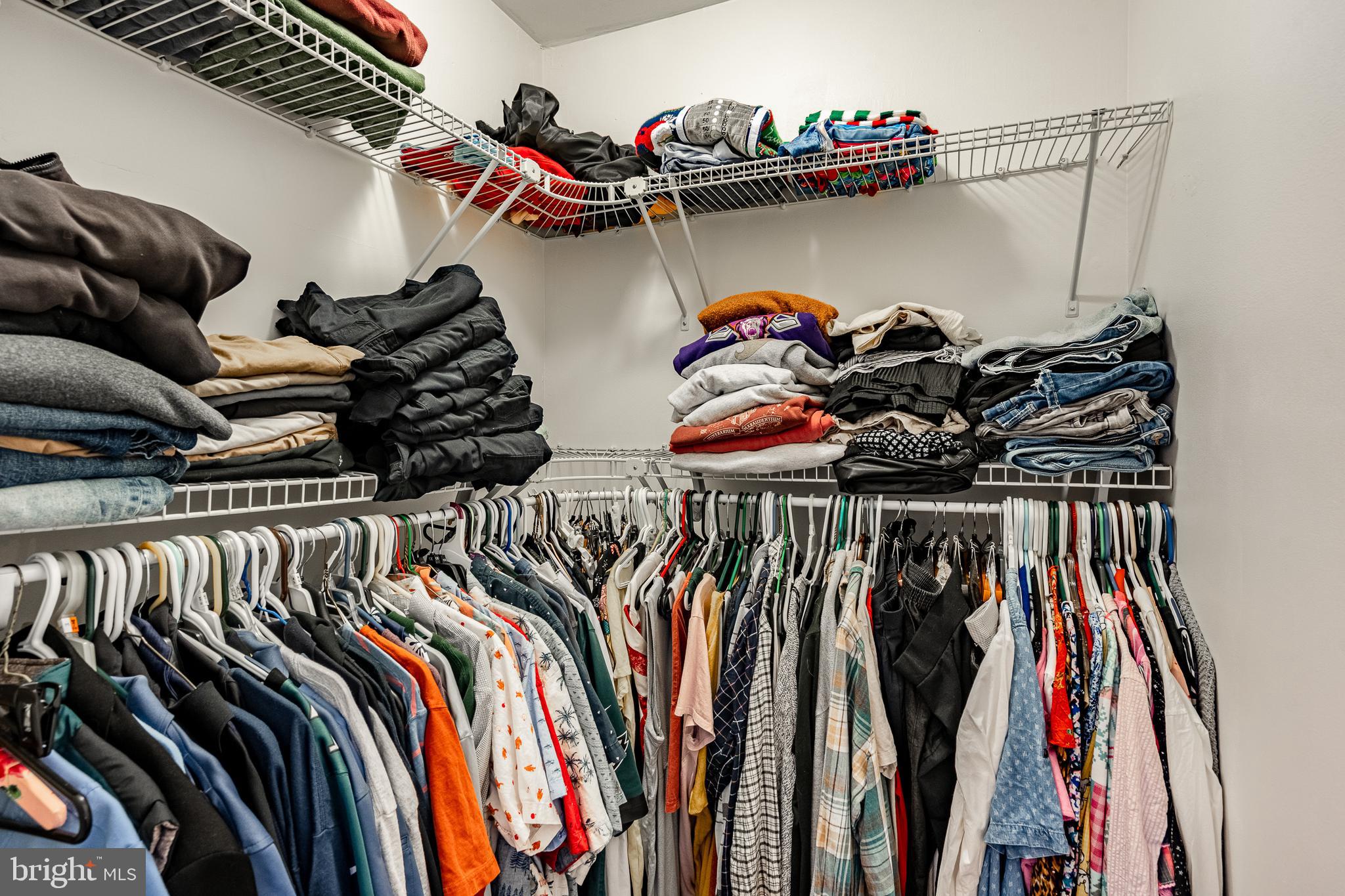 32-4 Wister Way Reading, PA 19606 - Photo 22 of 47 a view of walk in closet with clothes and shoes