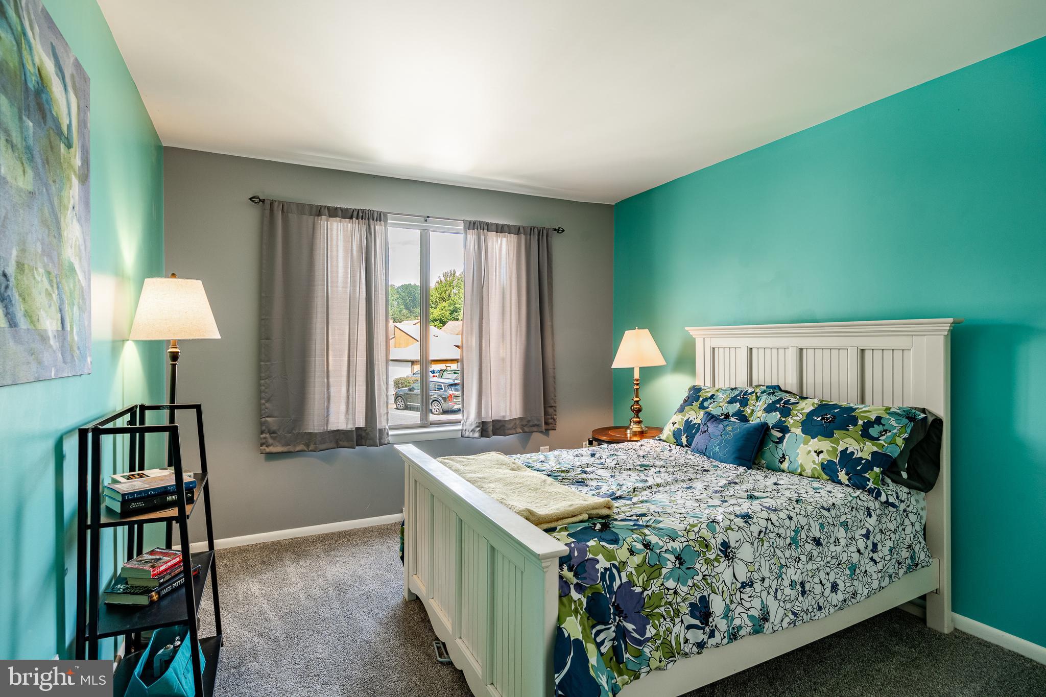 32-4 Wister Way Reading, PA 19606 - Photo 24 of 47 a bedroom with a bed table and a window