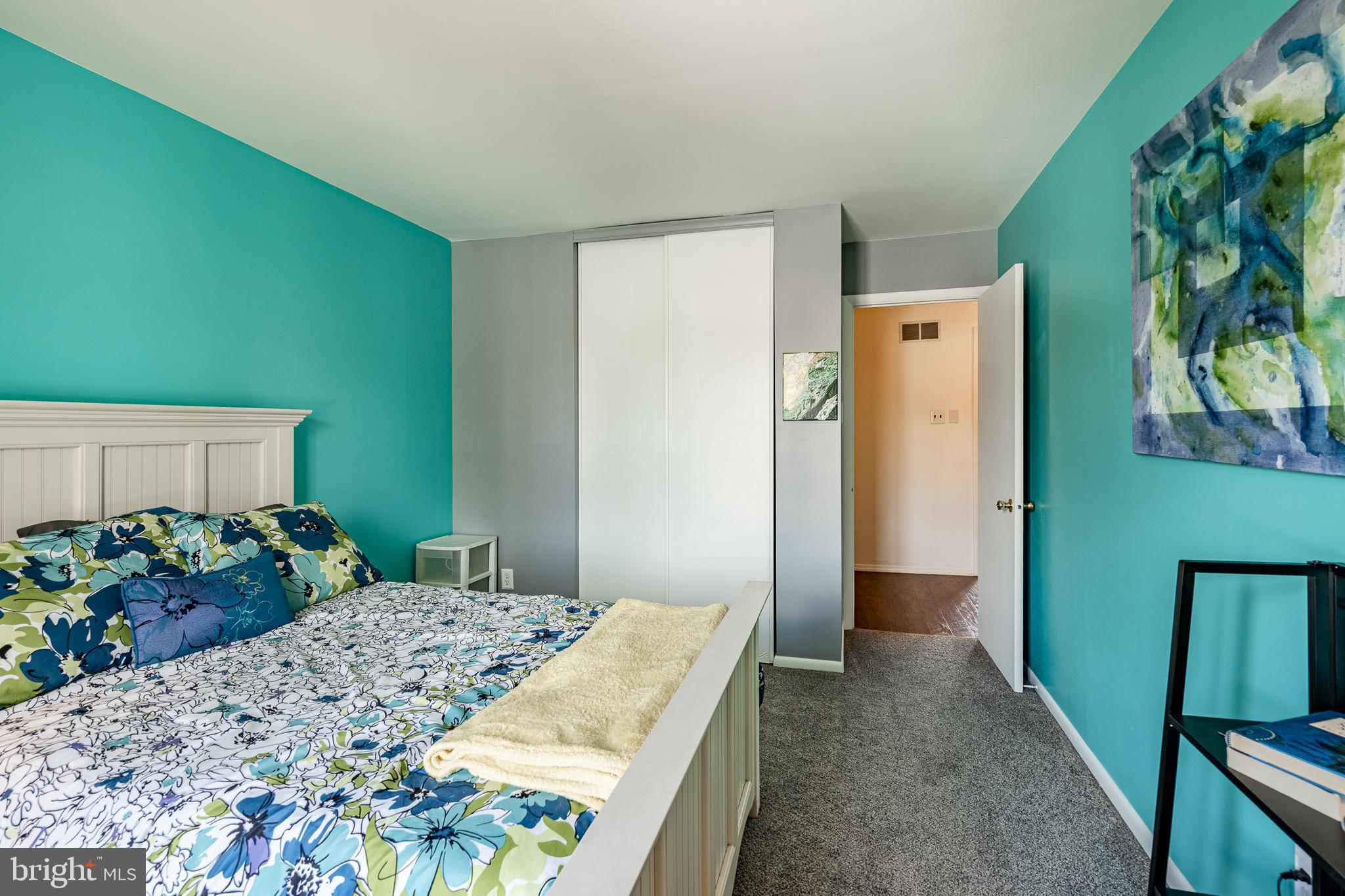 32-4 Wister Way Reading, PA 19606 - Photo 25 of 47 a bedroom with a bed and a dresser