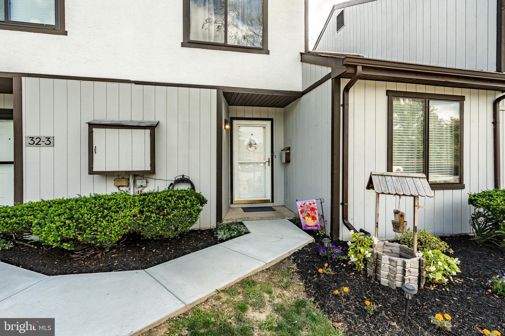 32-4 Wister Way Reading, PA 19606 - Photo 3 of 47 a front view of a house with garden