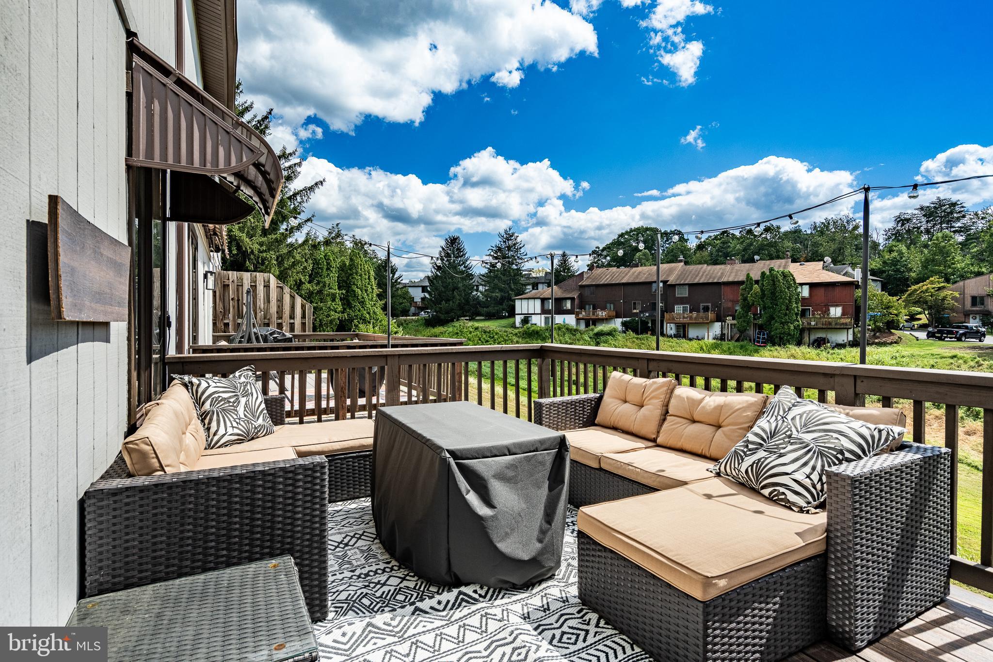 32-4 Wister Way Reading, PA 19606 - Photo 36 of 47 a balcony with furniture and wooden floor