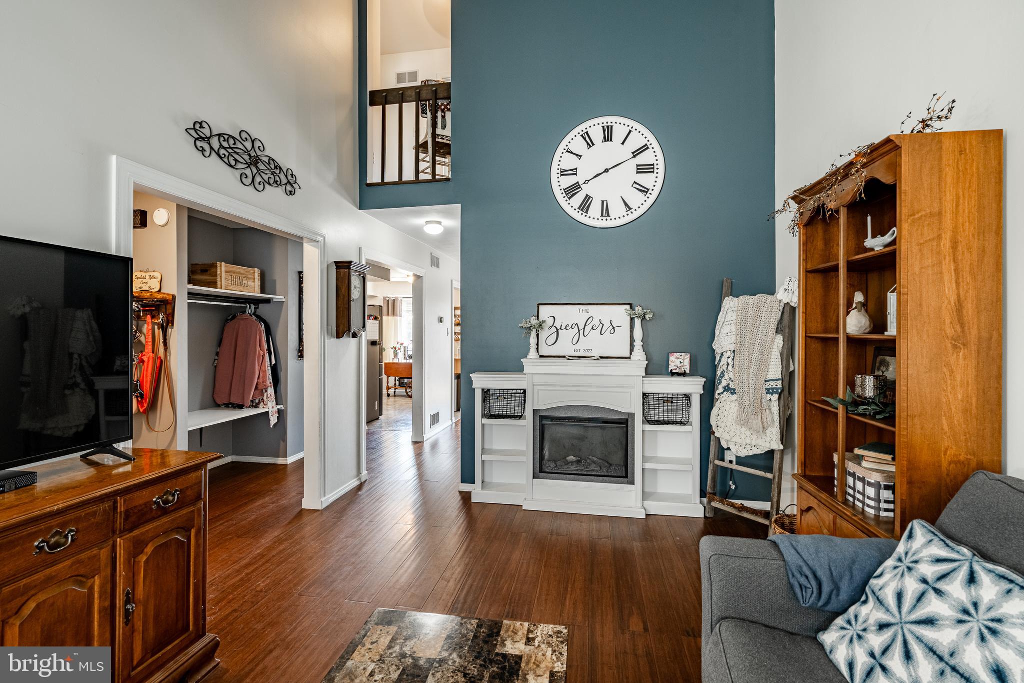 32-4 Wister Way Reading, PA 19606 - Photo 6 of 47 a view of a livingroom with furniture a flat screen tv and a stove