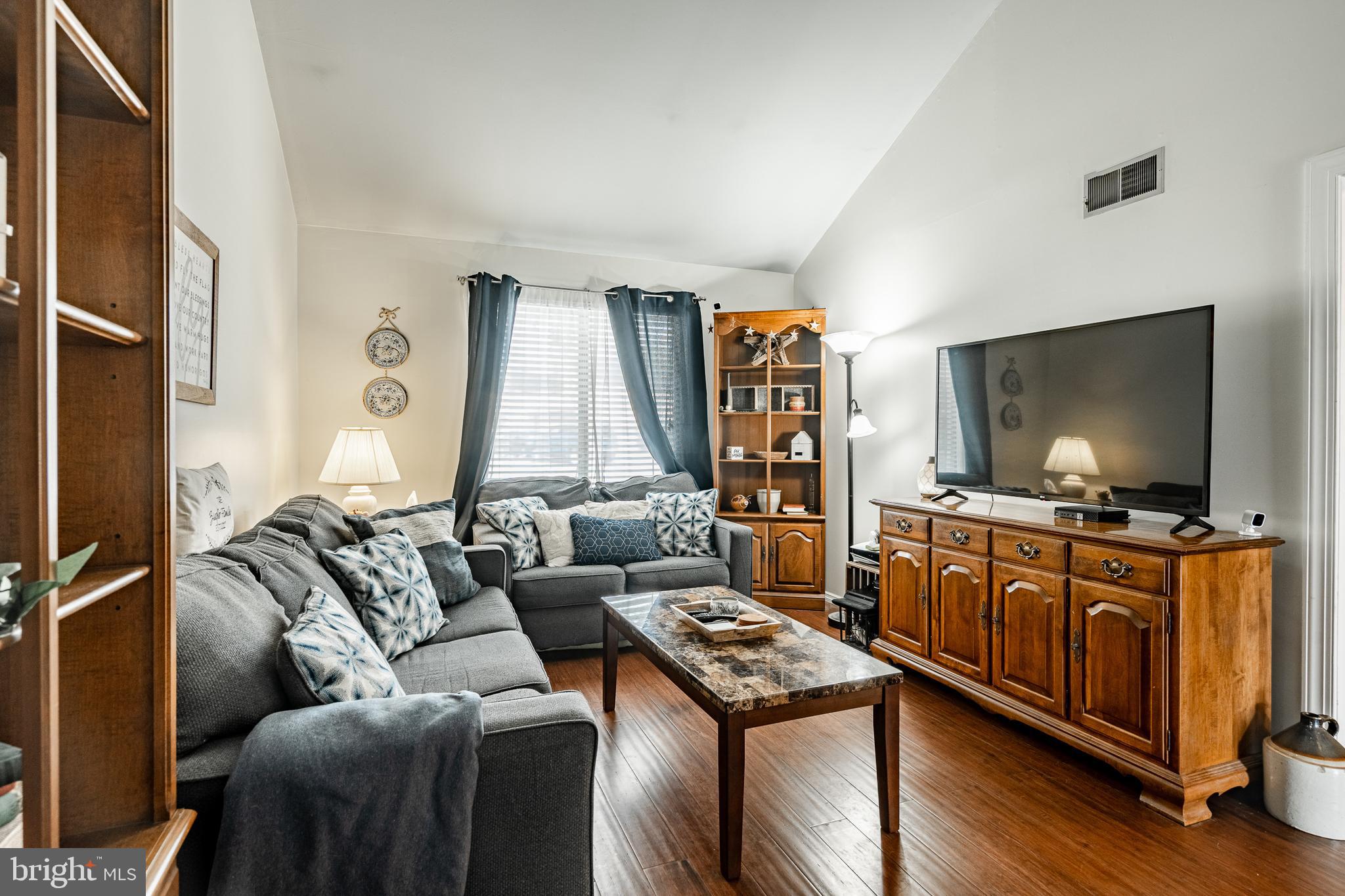 32-4 Wister Way Reading, PA 19606 - Photo 9 of 47 a living room with furniture and a flat screen tv